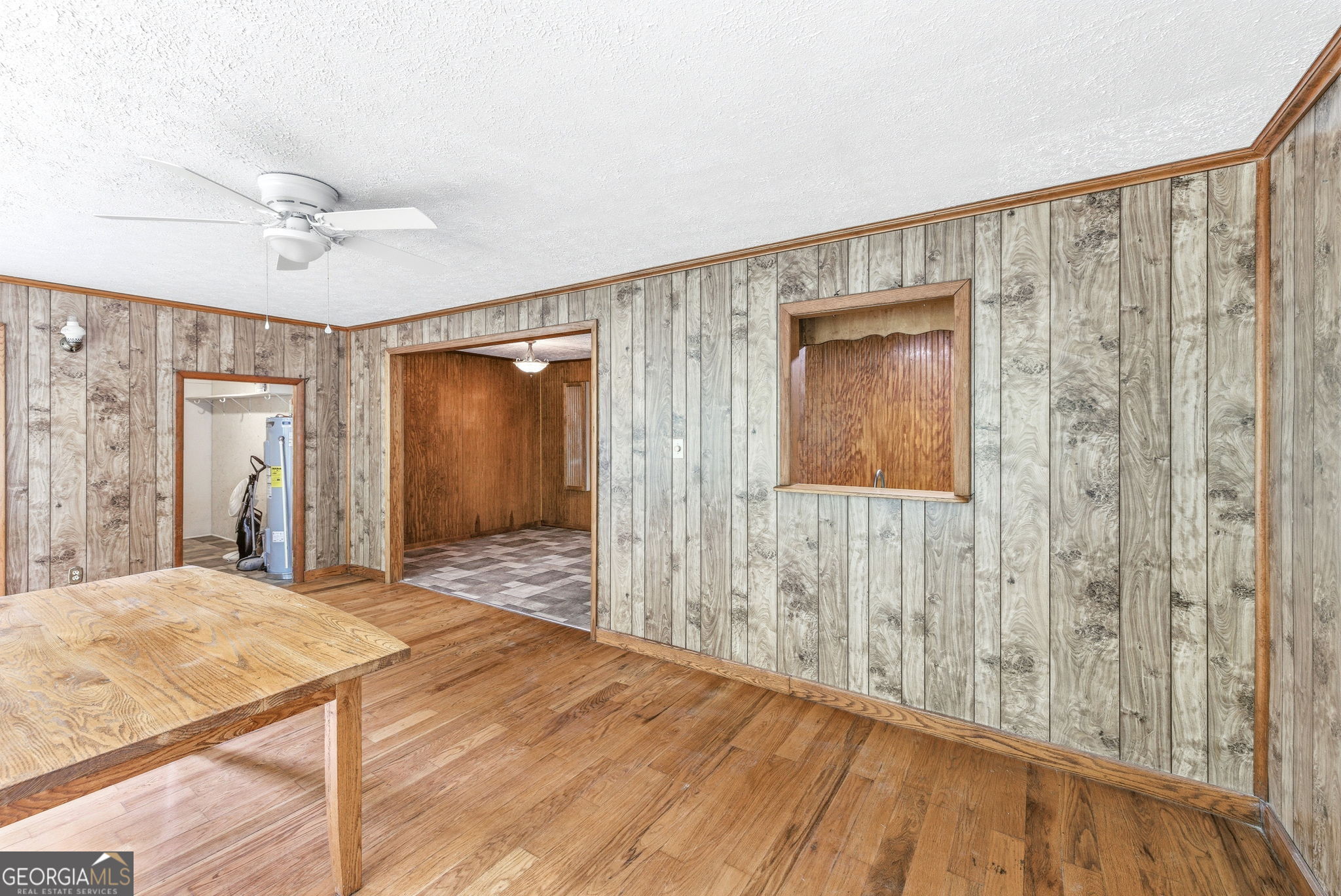 210 Kentucky Street Demorest, GA 30535 - Photo 16 of 30 a bedroom with a bed and a chandelier fan