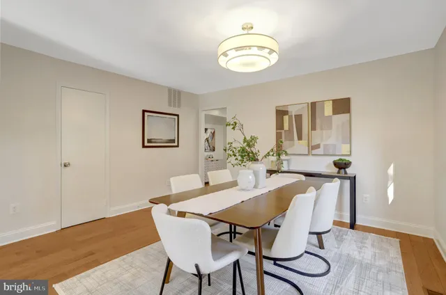 a view of a dining room with furniture and window