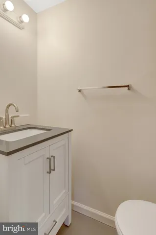 a bathroom with a sink and vanity