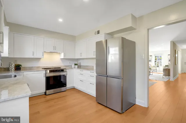 a view of room with painting on the wall