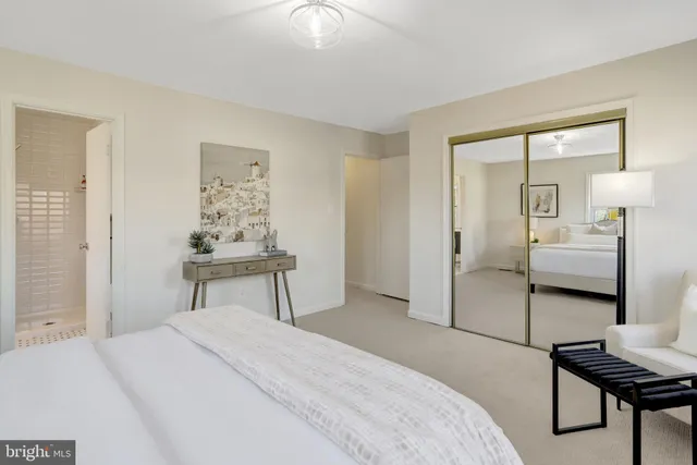 a bathroom with a toilet a window and a shower