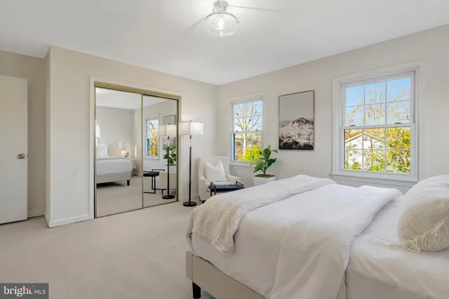 a bathroom with a sink a toilet and a window