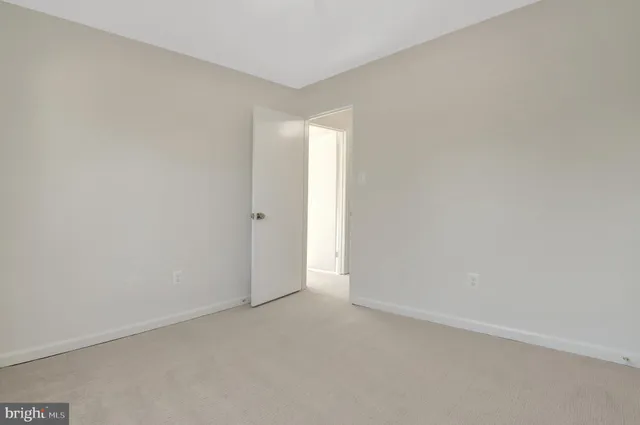 a view of empty room with windows