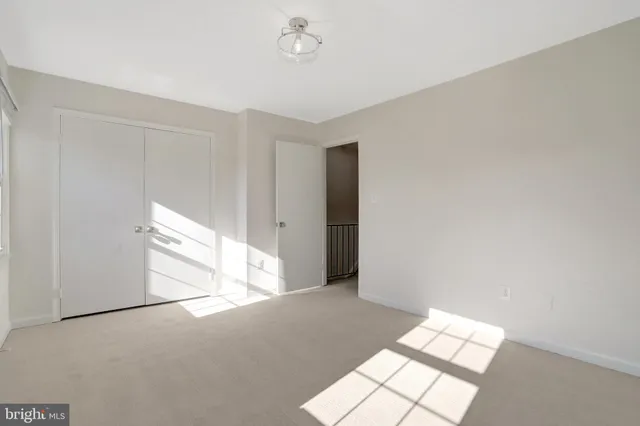 a view of a livingroom with stairs