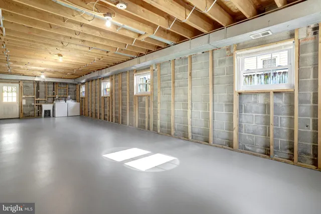 a view of a house with wooden fence