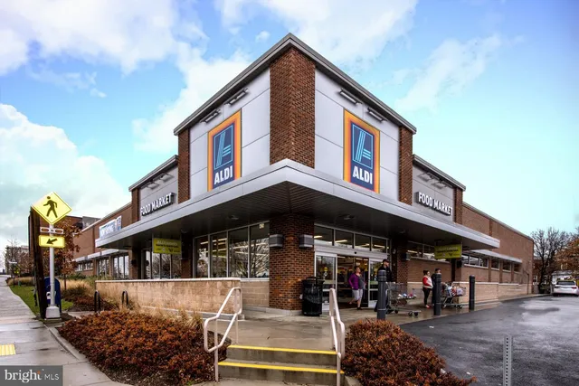 a front view of a retail shop with lots of flowers