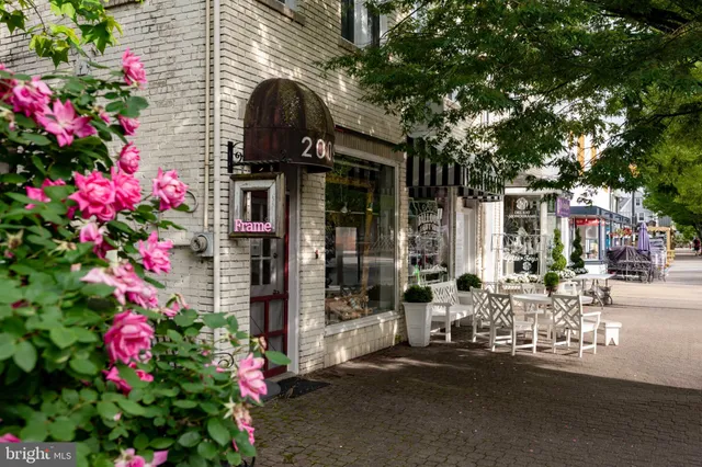 a couple of table and chairs in a street