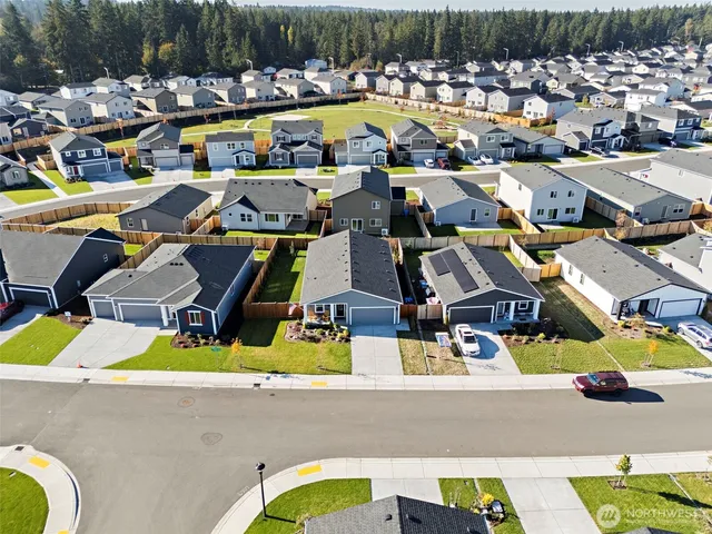 a view of swimming pool with outdoor seating and yard