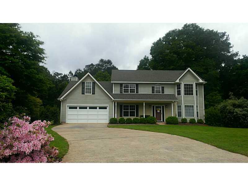 Exterior Front. Wonderful level yard, professionally landscaped