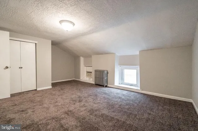 a view of empty room with windows