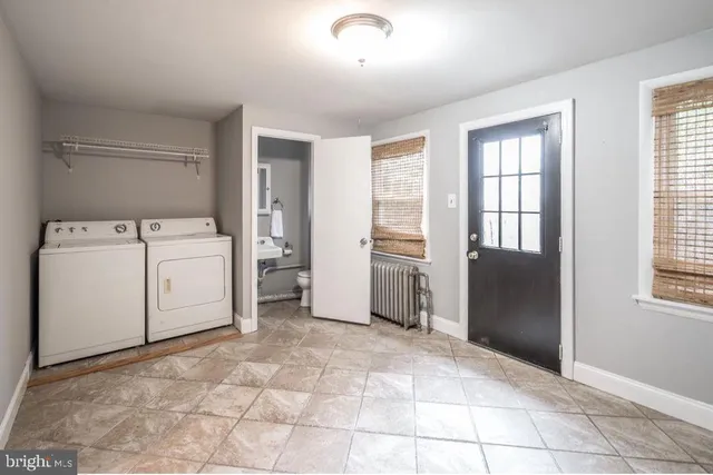 a view of a storage & utility room with washer and dryer