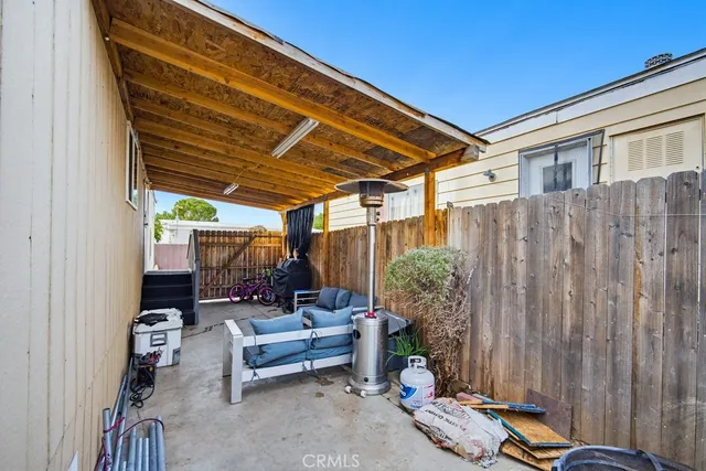 a view of a balcony with floor to ceiling windows