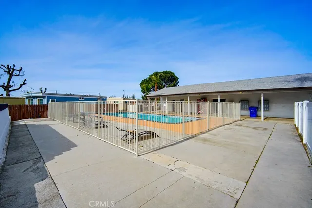 a view of a swimming pool with a lounge chairs