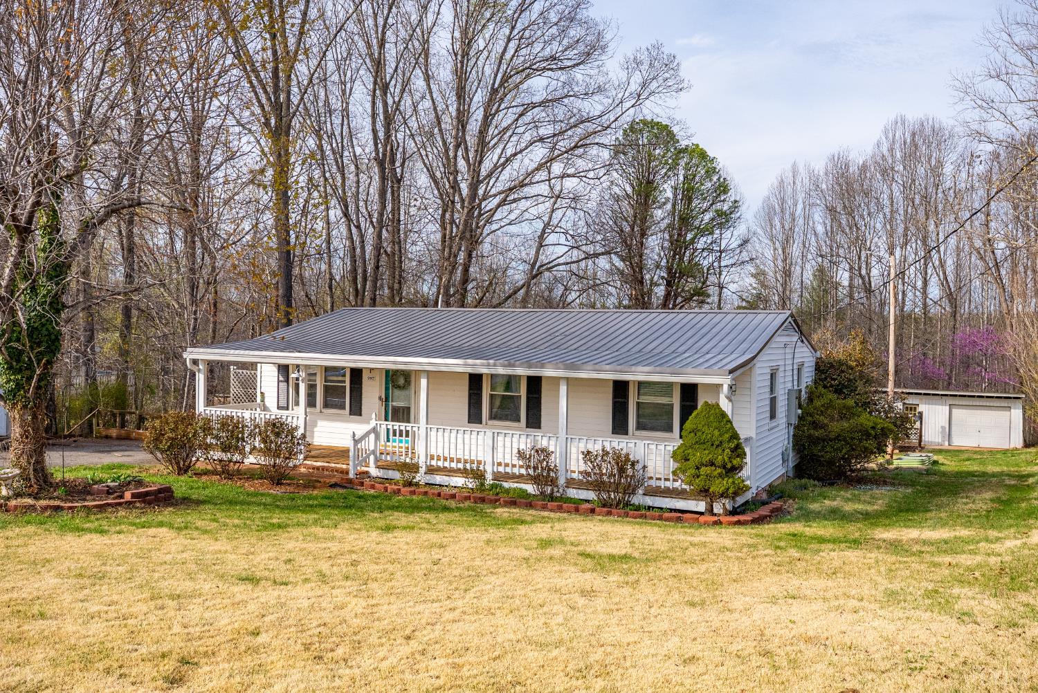 997 Toytown Road Amherst, VA 24521 - Photo 25 of 50 a front view of a house with swimming pool and porch