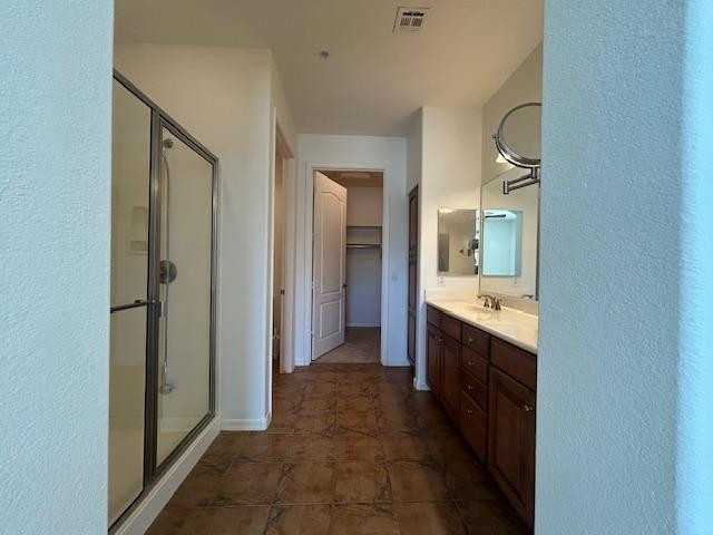 250 West Queen Creek Road, Unit 237 Chandler, AZ 85248 - Photo 11 of 18 a large bathroom with a double vanity sink and a mirror