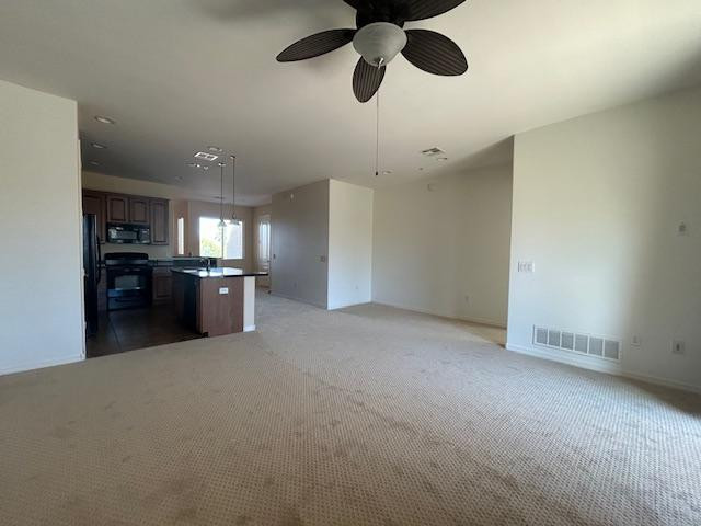 250 West Queen Creek Road, Unit 237 Chandler, AZ 85248 - Photo 5 of 18 a view of an empty room with a kitchen