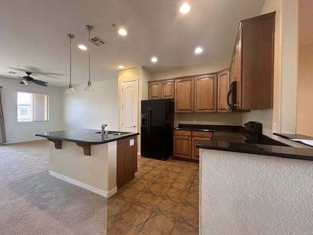 250 West Queen Creek Road, Unit 237 Chandler, AZ 85248 - Photo 6 of 18 a kitchen with stainless steel appliances granite countertop a sink a stove and a refrigerator