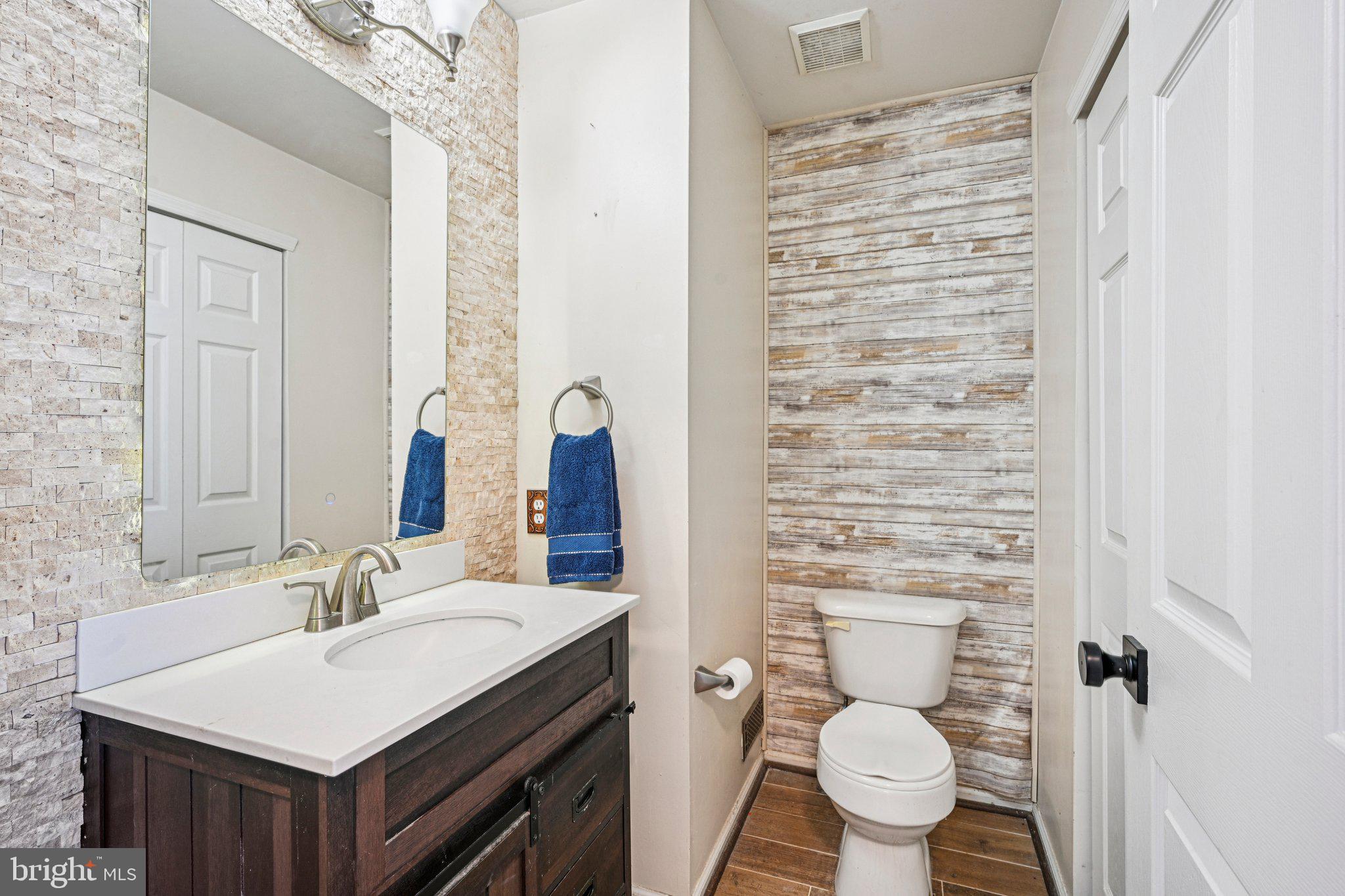 32 Millstream Road Pine Hill, NJ 08021 - Photo 16 of 36 a bathroom with a sink toilet vanity and shower