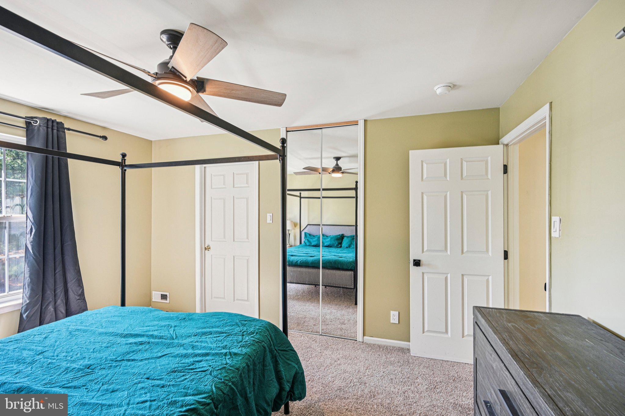 32 Millstream Road Pine Hill, NJ 08021 - Photo 20 of 36 a bedroom with a bed and a walk in closet