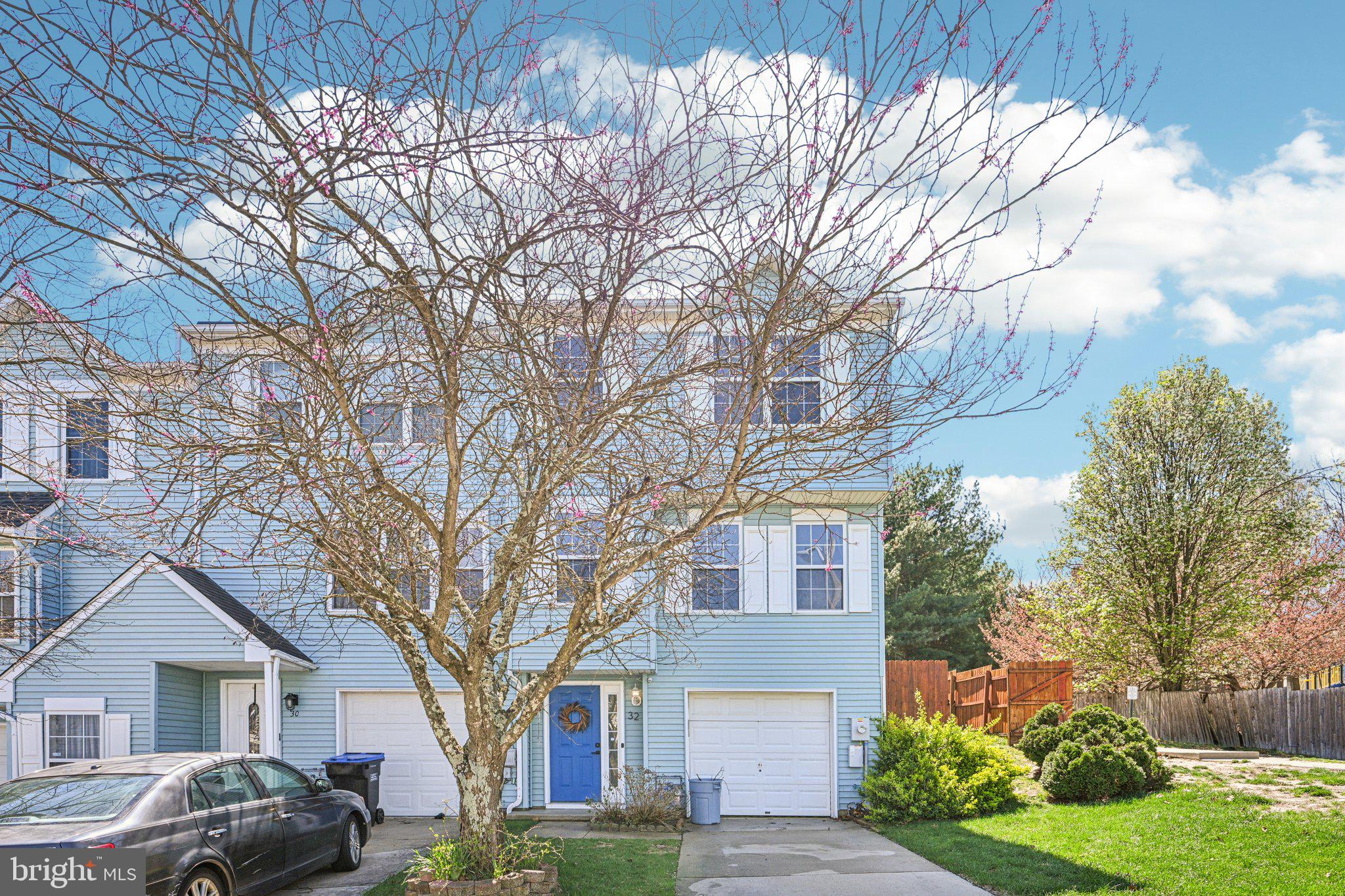 32 Millstream Road Pine Hill, NJ 08021 - Photo 2 of 36 a tree in front of a white house