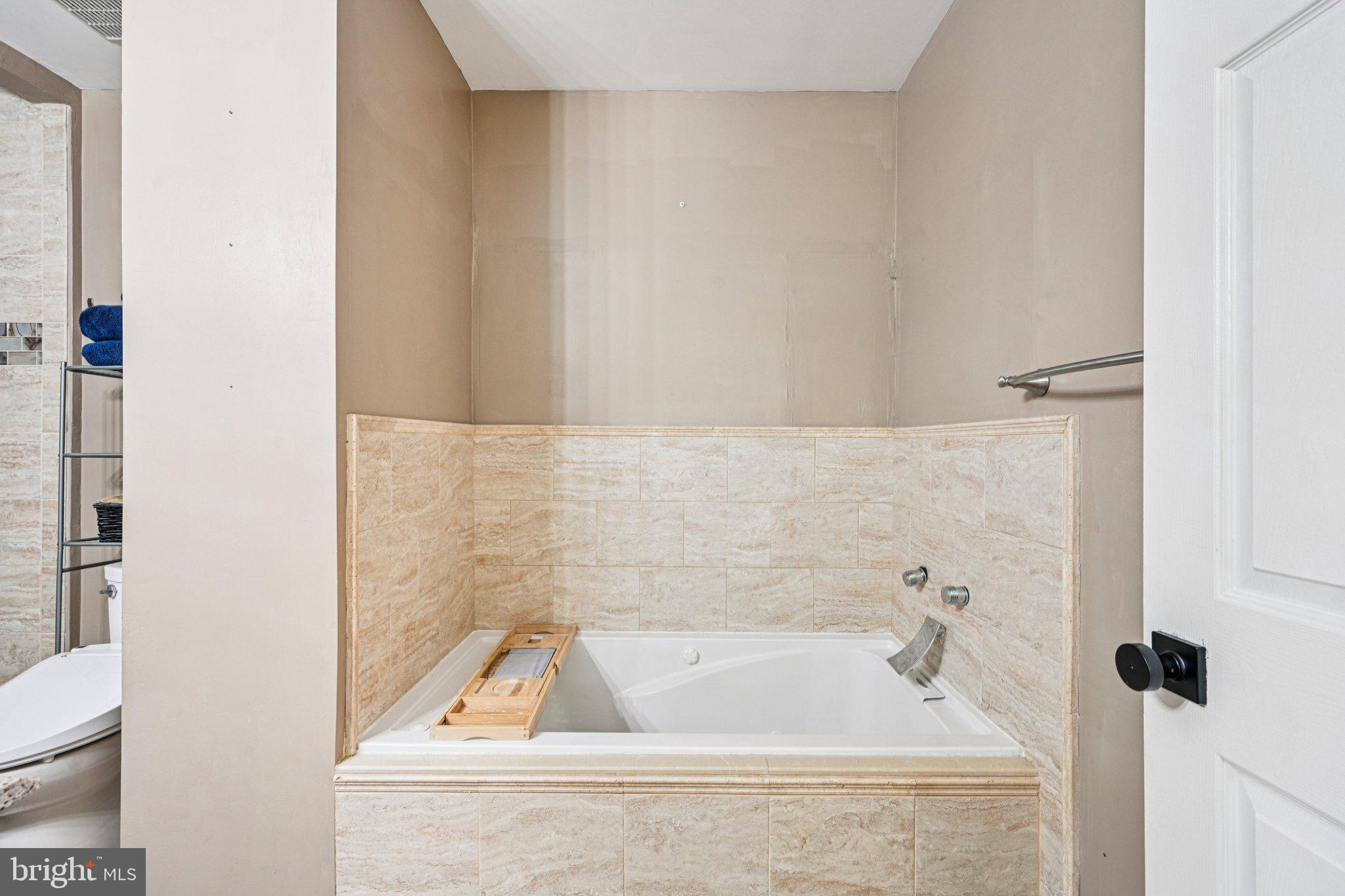 32 Millstream Road Pine Hill, NJ 08021 - Photo 25 of 36 a bath tub sitting next to a white sink