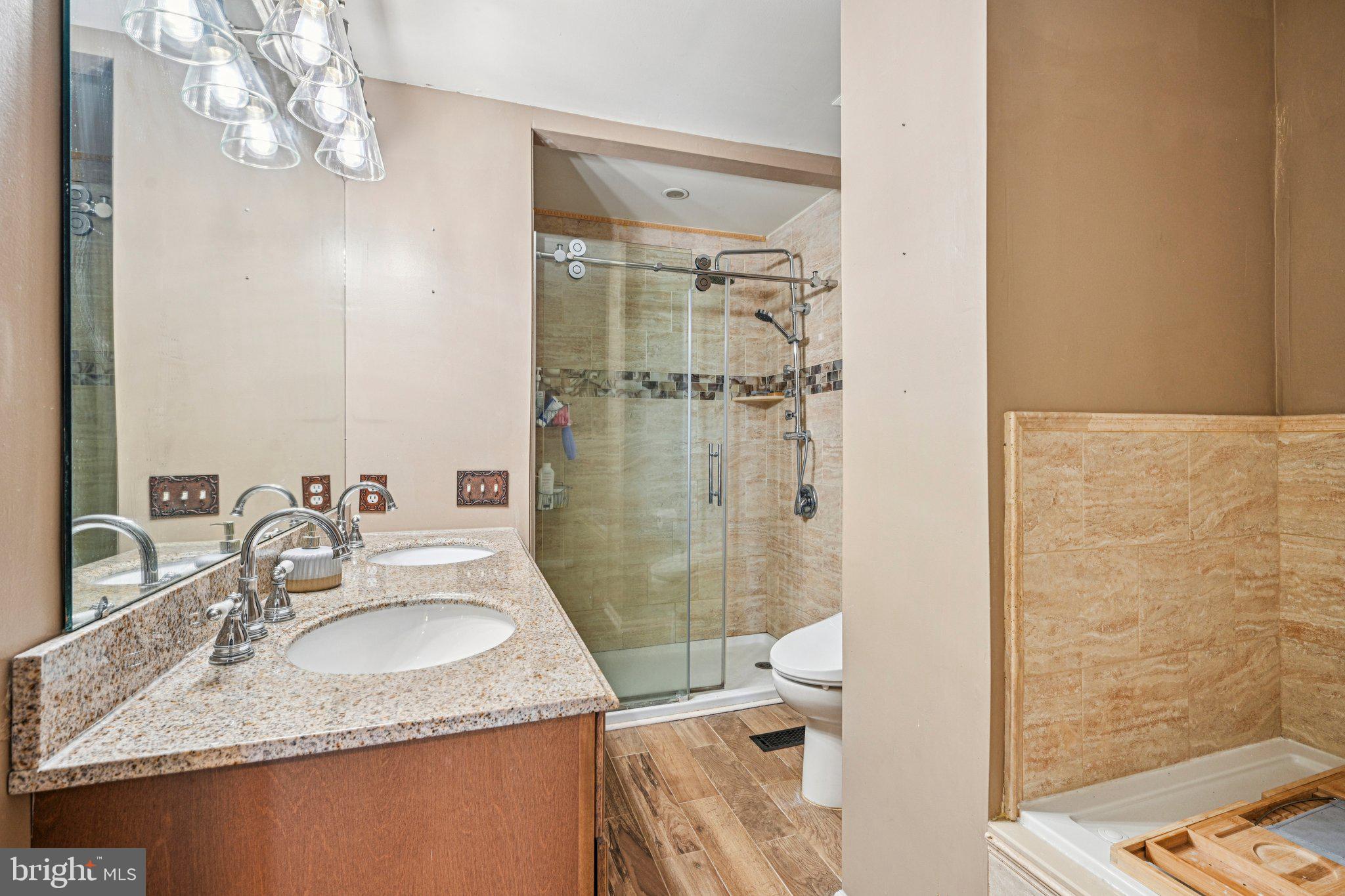 32 Millstream Road Pine Hill, NJ 08021 - Photo 26 of 36 a bathroom with a sink a toilet and shower