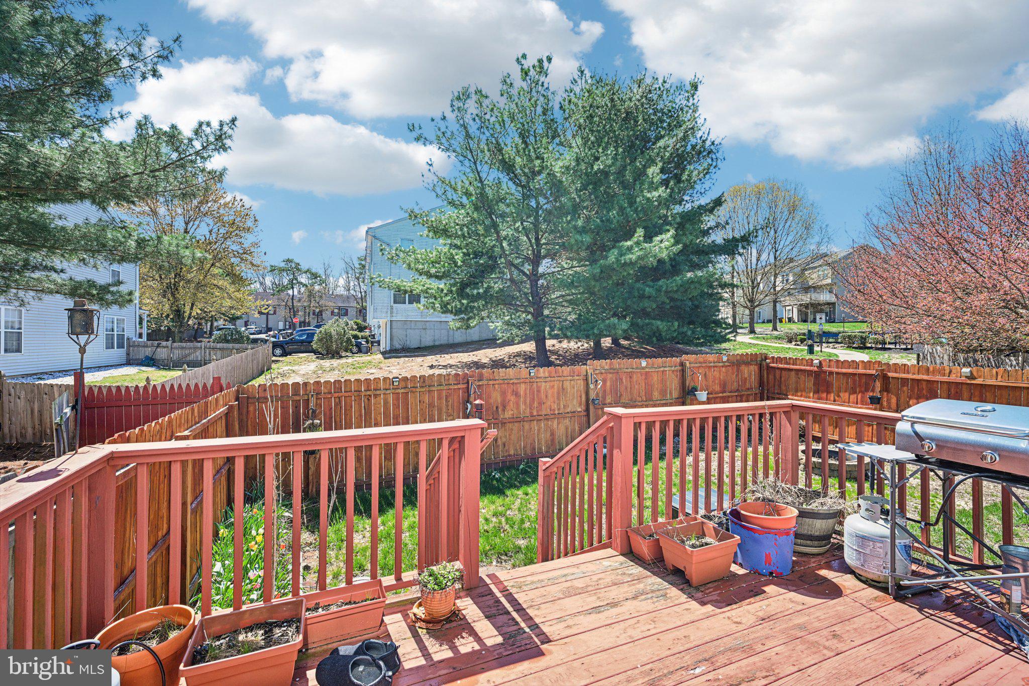 32 Millstream Road Pine Hill, NJ 08021 - Photo 30 of 36 a view of a deck with two chairs and a table