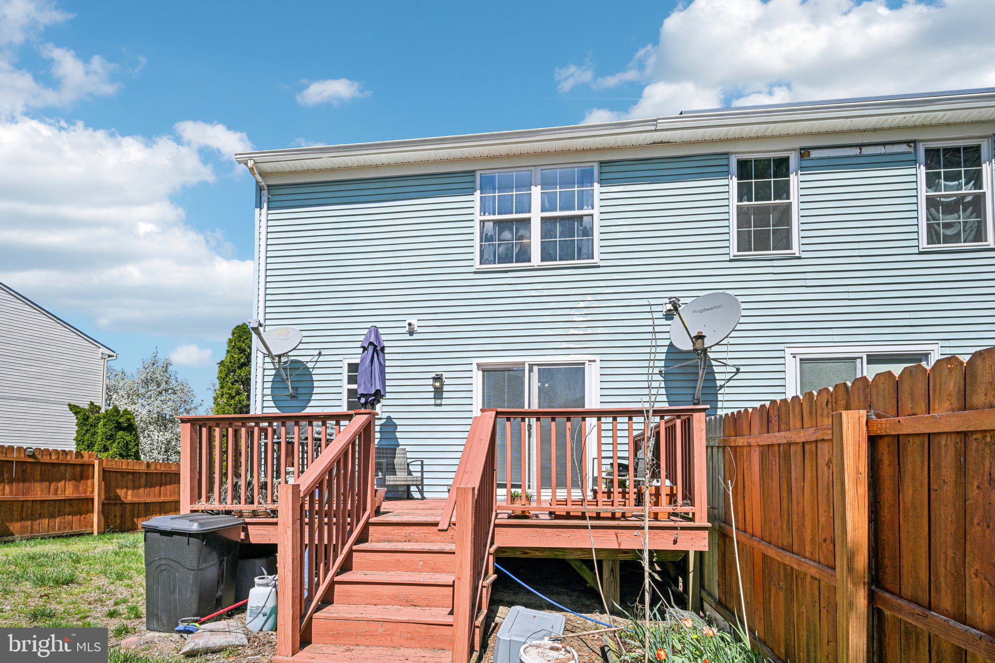 32 Millstream Road Pine Hill, NJ 08021 - Photo 34 of 36 a view of deck with a chair under an umbrella