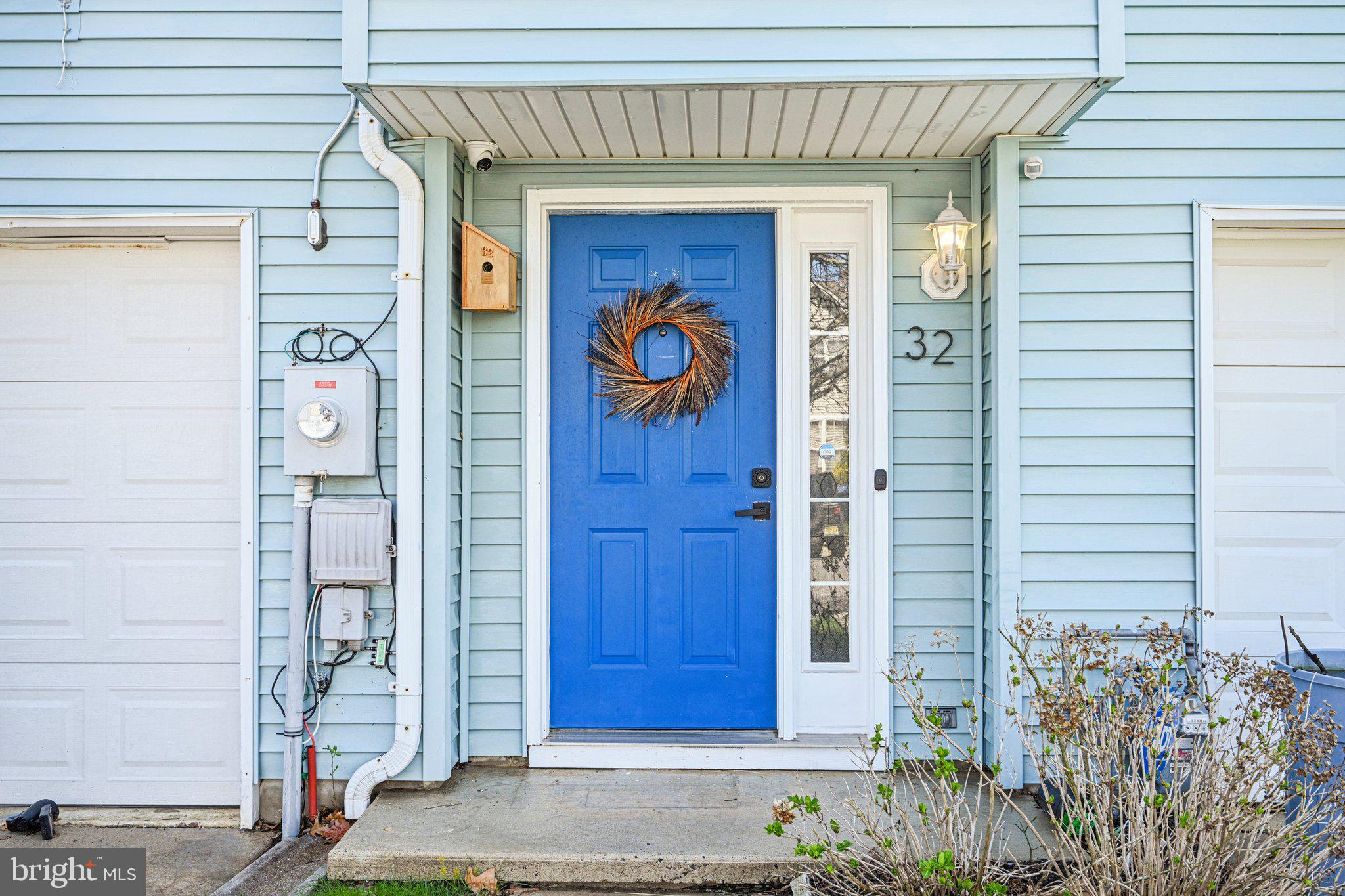 32 Millstream Road Pine Hill, NJ 08021 - Photo 4 of 36 a front view of a house with a wooden door