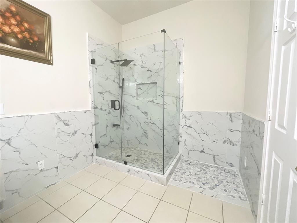 6404 Meadowview Court Plano, TX 75024 - Photo 15 of 33 a bathroom with a shower