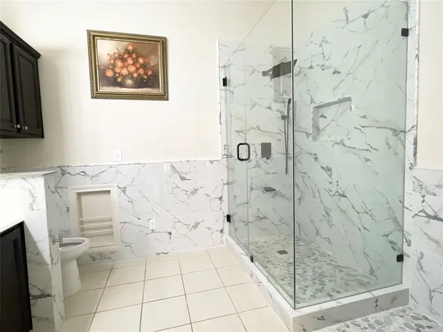 a bathroom with a double vanity sink mirror and bathtub