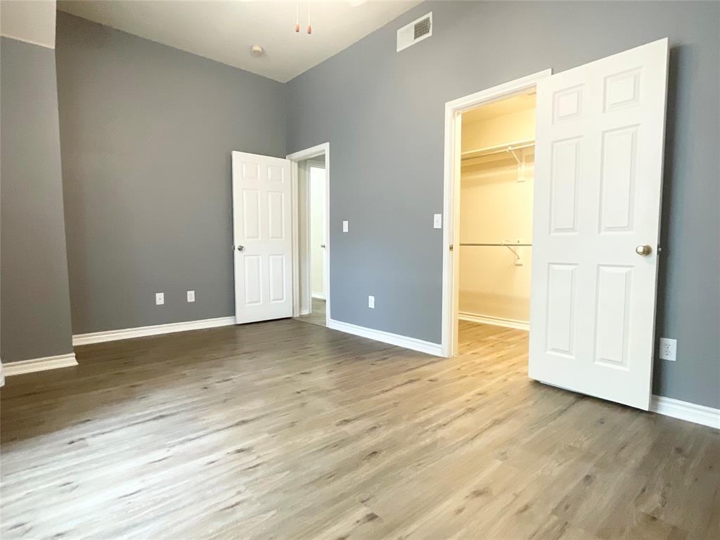 6404 Meadowview Court Plano, TX 75024 - Photo 21 of 33 a view of an empty room with wooden floor
