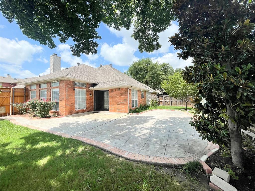 6404 Meadowview Court Plano, TX 75024 - Photo 23 of 33 a front view of a house with a yard and trees