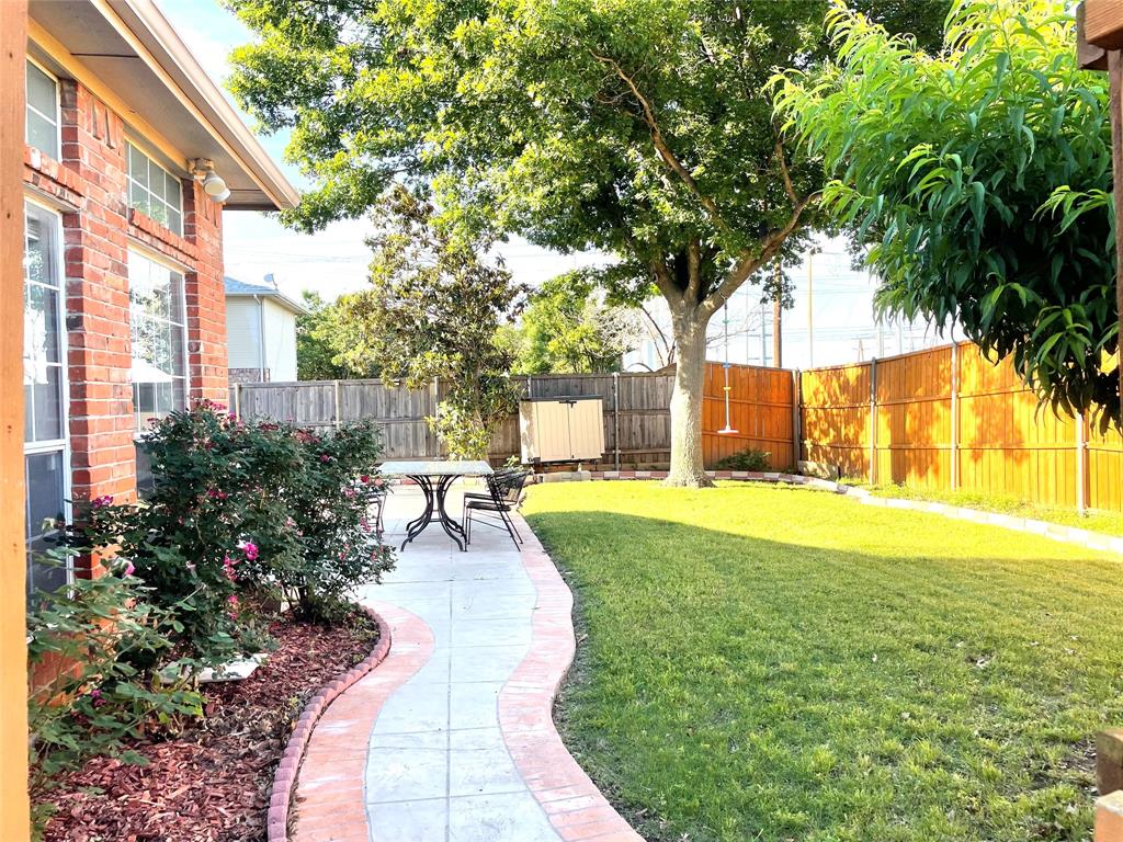 6404 Meadowview Court Plano, TX 75024 - Photo 26 of 33 a view of a backyard with garden