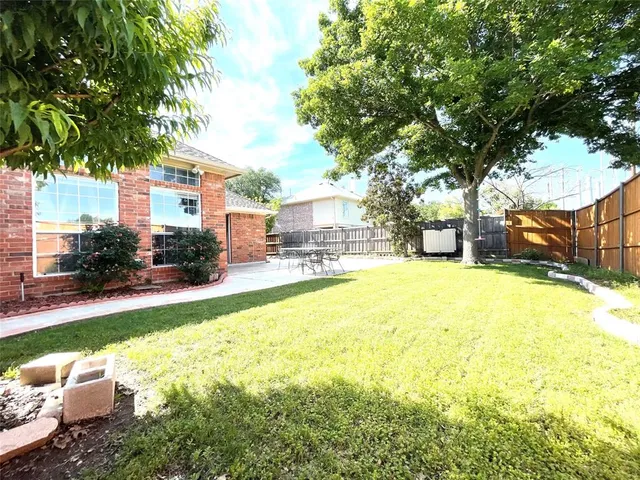 a view of a backyard with garden
