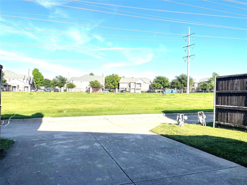 6404 Meadowview Court Plano, TX 75024 - Photo 31 of 33 a view of a swimming pool and a yard