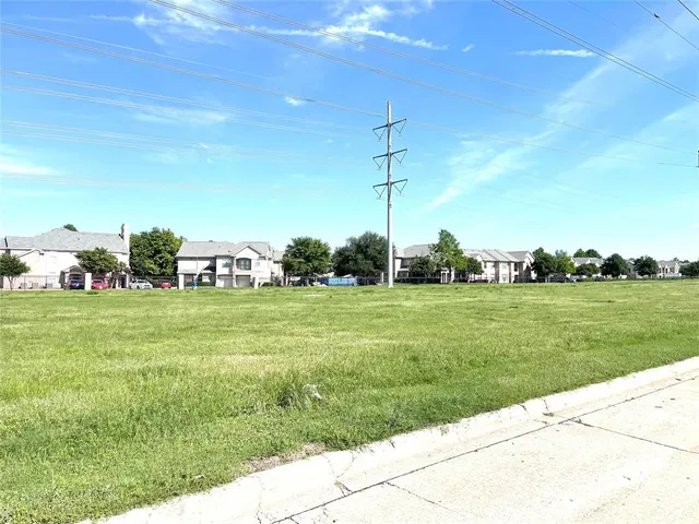 a view of a swimming pool and a yard