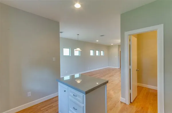 a kitchen that has a sink and a stove in it