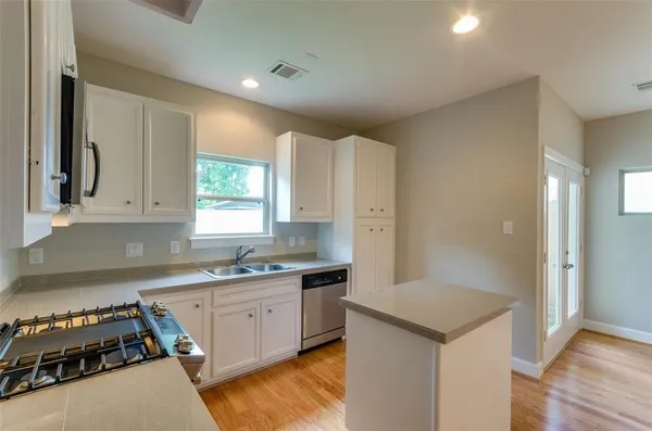 a bathroom with a sink a toilet and vanity