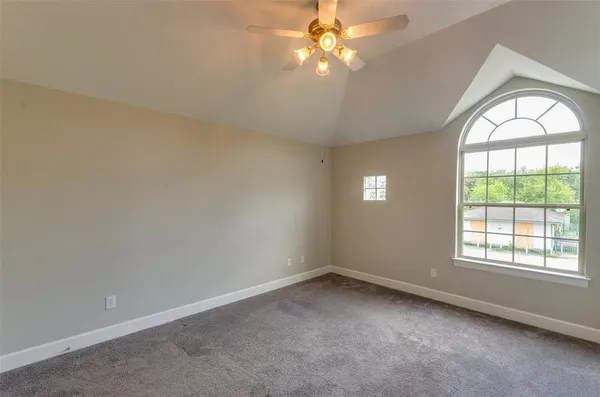 a spacious bathroom with double sink and a mirror