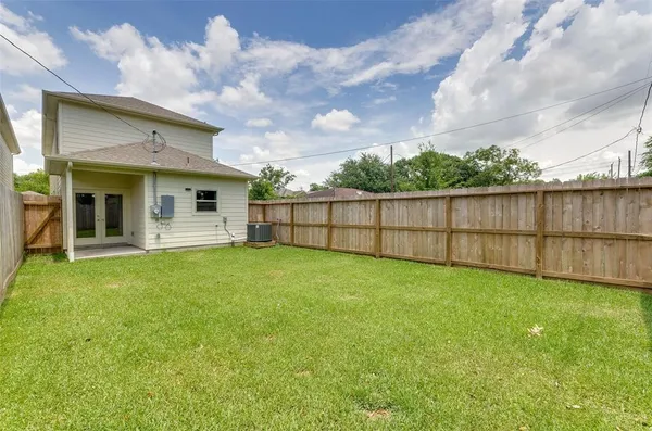 a view of a backyard with a garden and plants