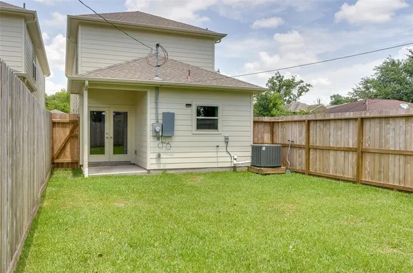 a view of a backyard with a garden and plants