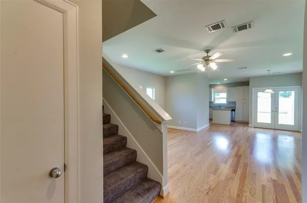 a view of an entryway with wooden floor