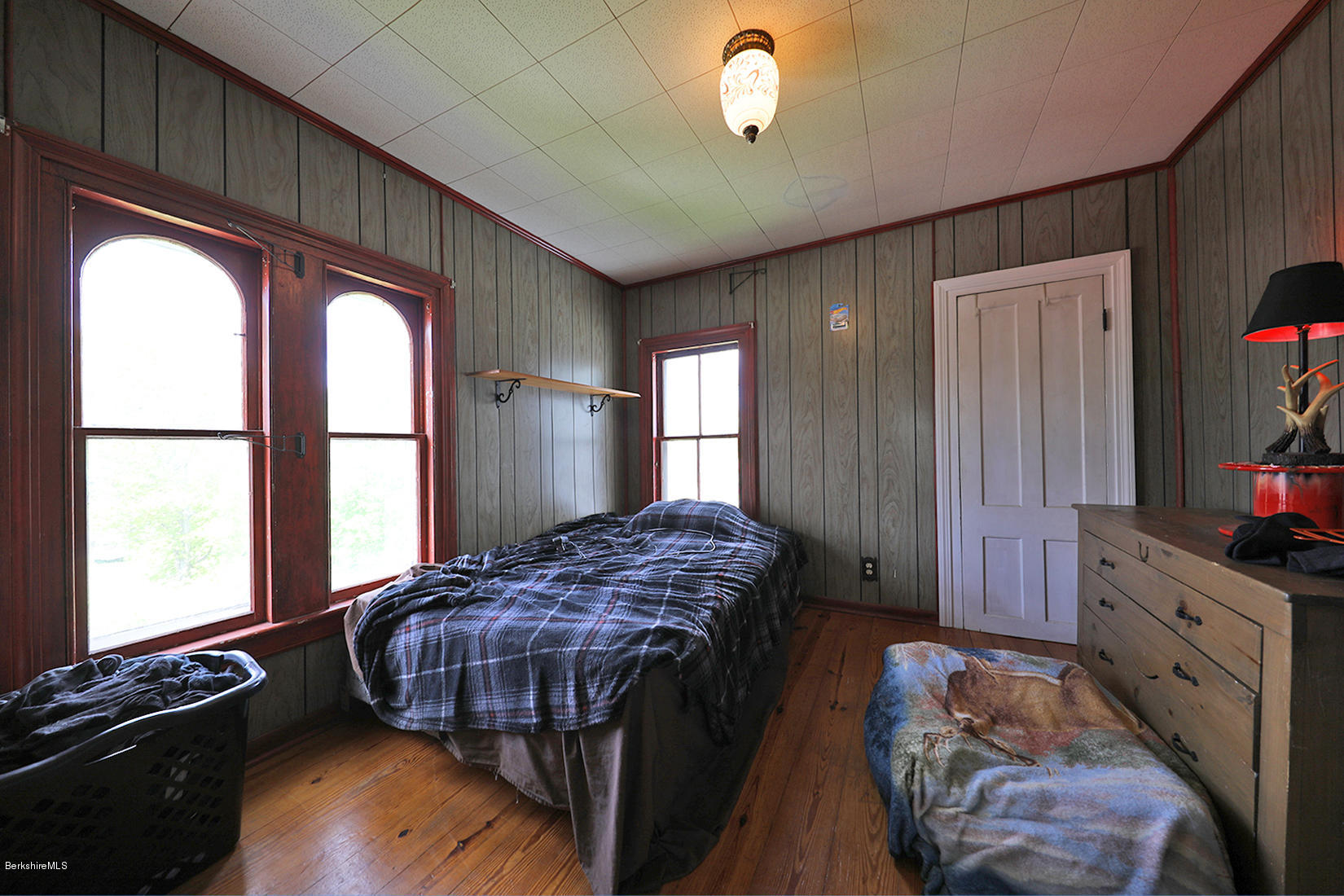 3 Lenox Road West Stockbridge, MA 01266 - Photo 16 of 20 a bedroom with a bed next to a window with wooden floor