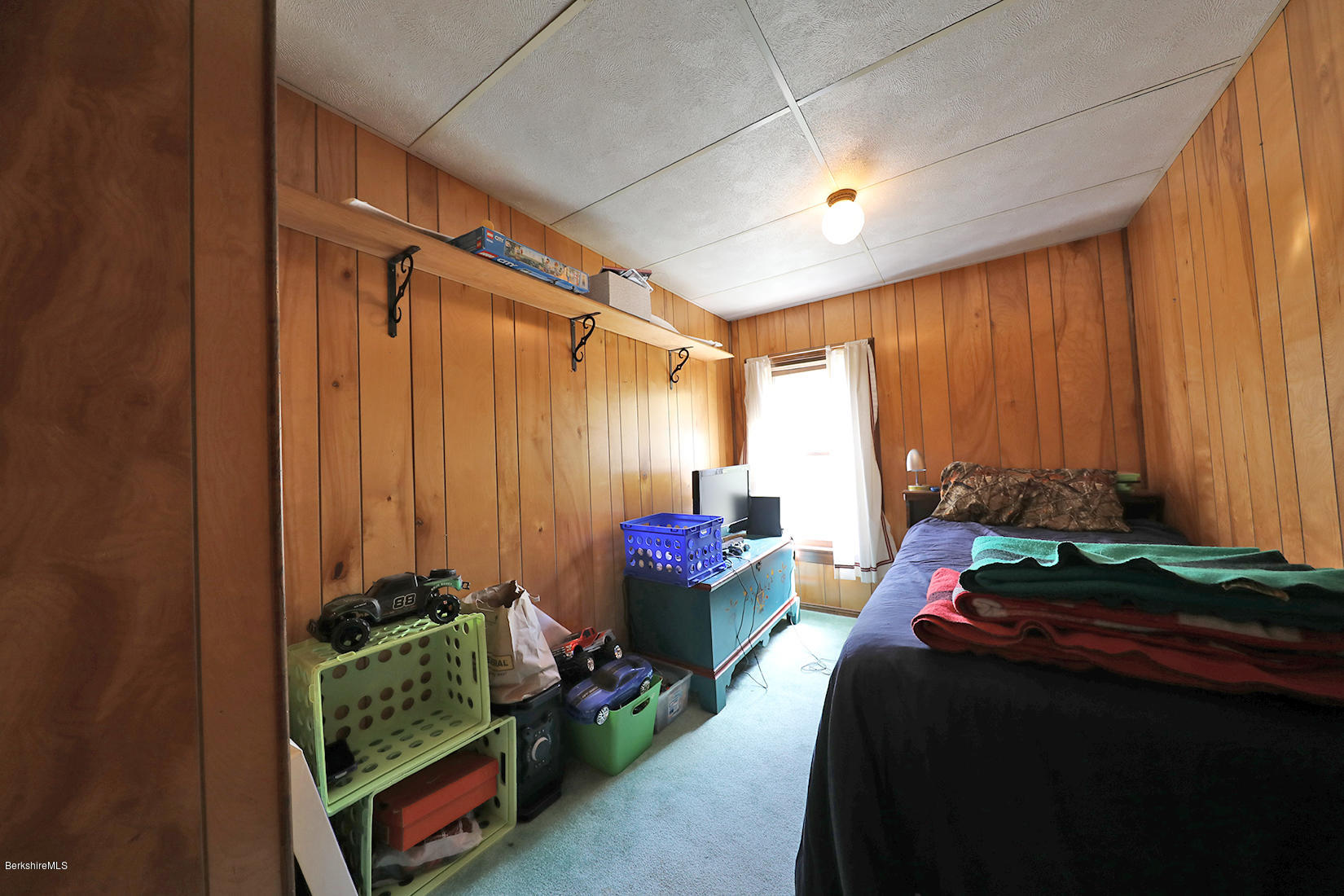3 Lenox Road West Stockbridge, MA 01266 - Photo 17 of 20 a bed room with a bed table and a chair