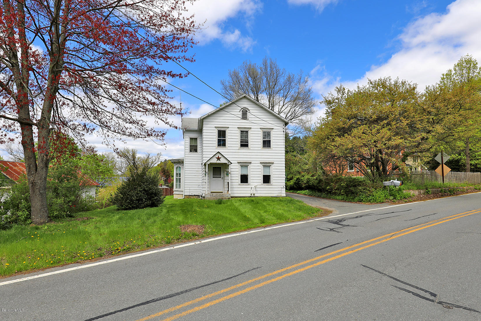 3 Lenox Road West Stockbridge, MA 01266 - Photo 19 of 20 a front view of a house with a yard and trees