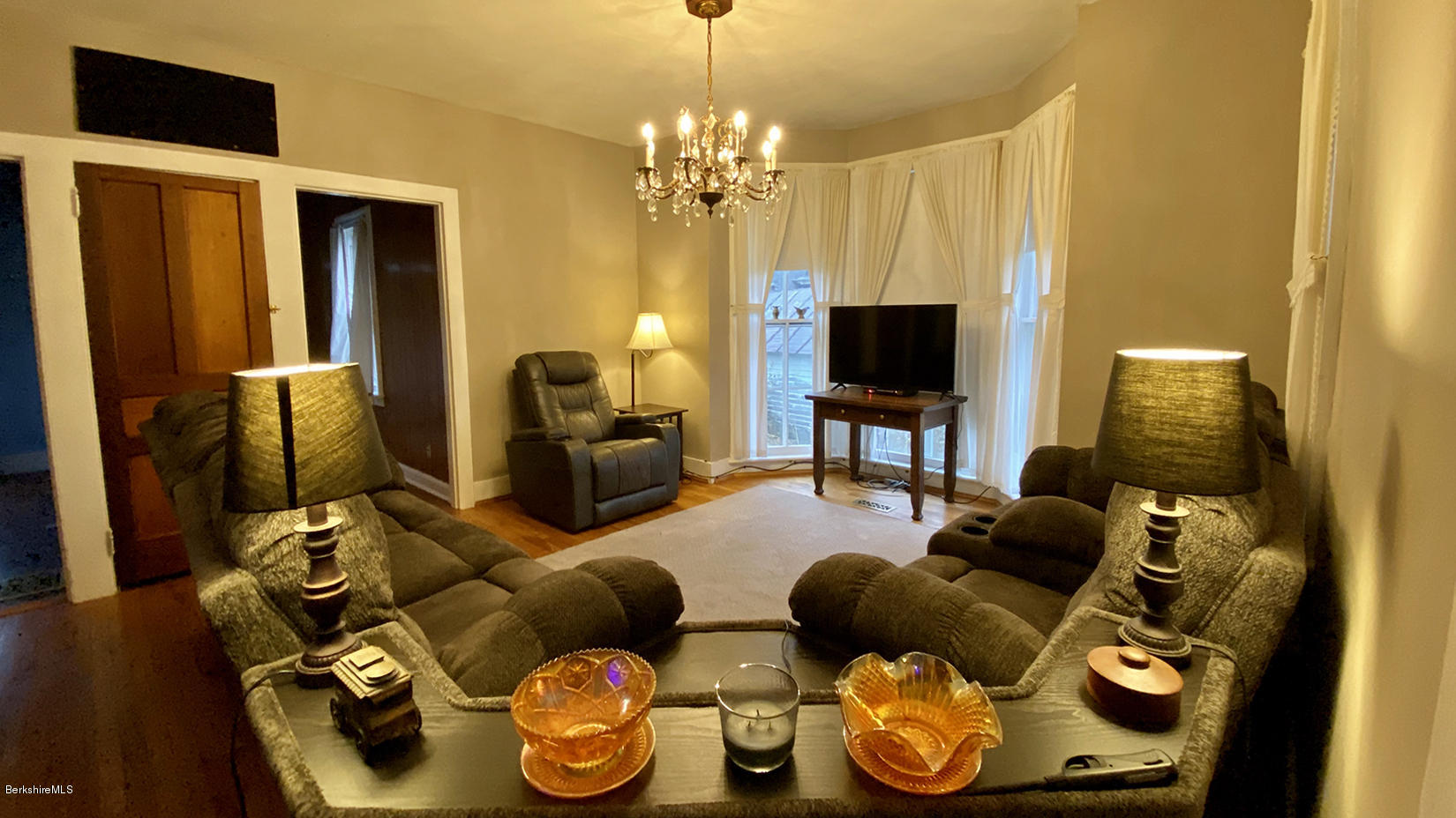 3 Lenox Road West Stockbridge, MA 01266 - Photo 6 of 20 a living room with furniture and a chandelier