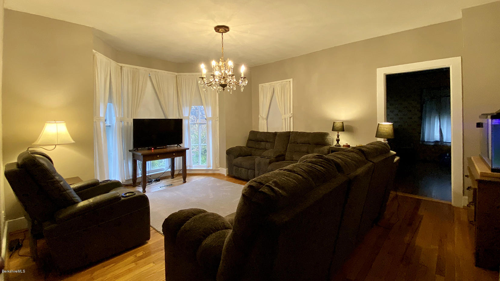 3 Lenox Road West Stockbridge, MA 01266 - Photo 7 of 20 a living room with furniture a chandelier and a flat screen tv