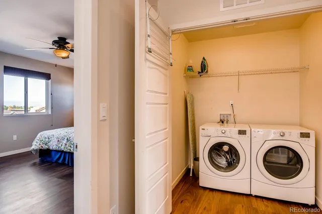 a view of a bedroom with washer and dryer