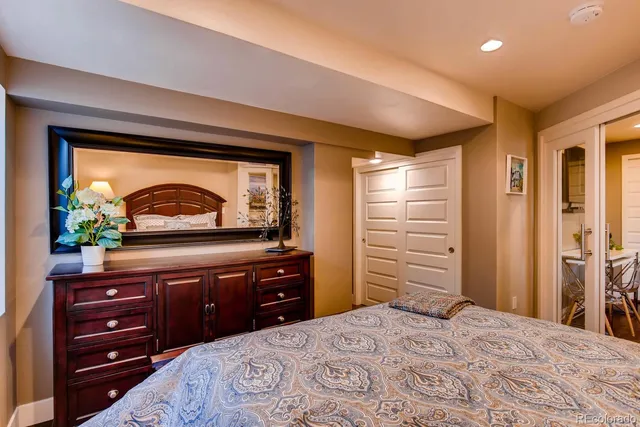 a bedroom with a bed and a dresser